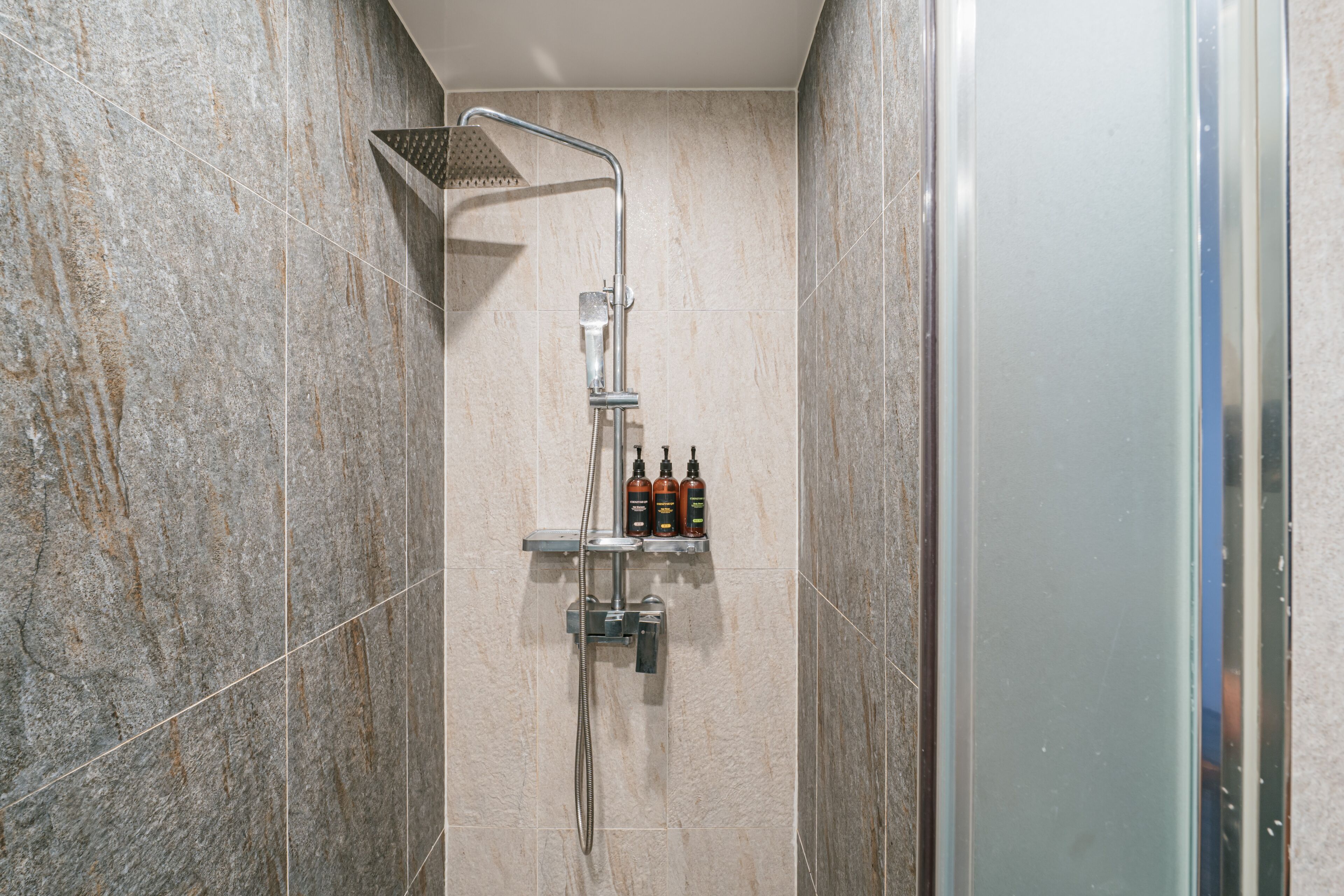 deluxe triple room | bathroom | shower, free toiletries, hair dryer, slippers