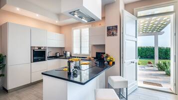 Fridge, microwave, cookware/dishes/utensils