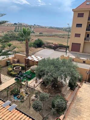 Enjoy a serene view of the surrounding hills from the comfort of your patio.