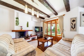 TV, fireplace, DVD player, ping pong - Stunning Country Home "Finca Sanau" Near the Beach with Sea View, Outdoor Pool, A/C, Wi-Fi, Garden, Balcony & Terrace; Parking Available (S'Horta)