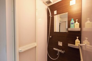 Shower, free toiletries, hair dryer, slippers