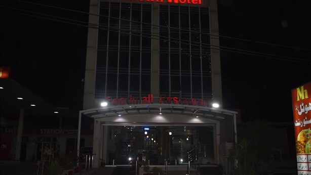 The exterior of the Midtown Hotel with a prominent sign above the entrance. - Mid Town Hotel (Islamabad)