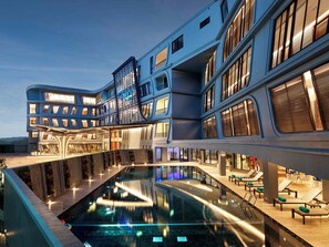 A modern hotel with a pool, multiple balconies, and a rooftop terrace. - The Oceanic Sportel (Ko Kaeo)
