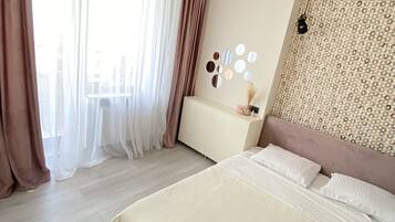 2 habitaciones, tabla de planchar con plancha, wifi y ropa de cama