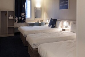 A hotel room with two beds, a desk, a mirror, and a window with curtains. - ACE Hôtel Lyon Vénissieux (Venissieux)