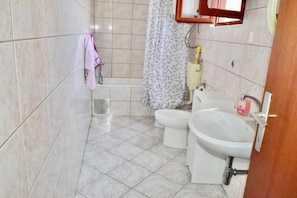 Combined shower/tub, hair dryer, towels, soap