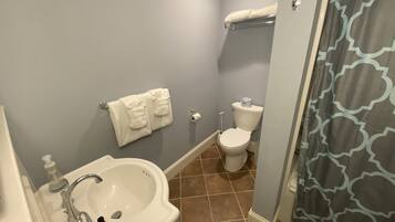 Combined shower/tub, hair dryer, towels, soap