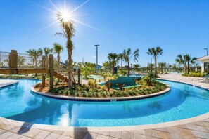 A clear blue pool with a 3 ft depth marker, surrounded by palm trees and a wooden deck.