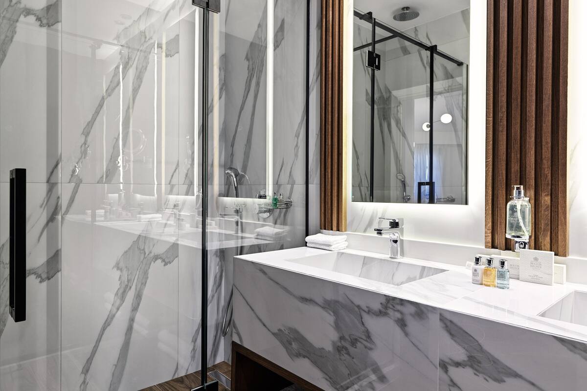 executive suite | bathroom | designer toiletries, hair dryer, bathrobes, slippers