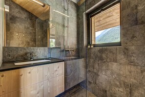 Bathtub, hair dryer, towels, soap