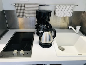 Fridge, stovetop, electric kettle, toaster