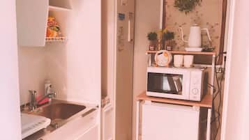 Fridge, microwave, cookware/dishes/utensils