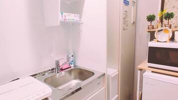 Fridge, microwave, cookware/dishes/utensils