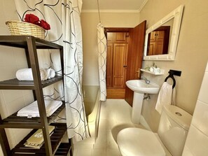 Bathtub, hair dryer, towels