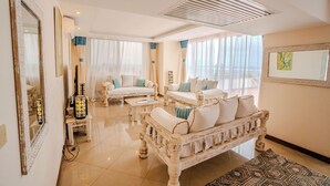 A spacious living room with a white sofa set, a coffee table, and a patterned rug. - Kilua Residences by CityBlue, Mombasa (Mombasa)