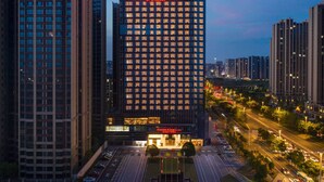 A high-rise hotel with a prominent sign reading "RAMADA PLAZA BY WYNDHAM." - Ramada Plaza by Wyndham Xiangtan Wanlou (Xiangtan)