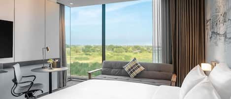 Deluxe Room, 1 King Bed, Corner | Minibar, desk, laptop workspace, soundproofing