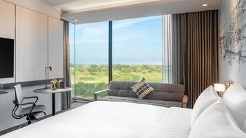 Deluxe Room, 1 King Bed, Corner | Minibar, desk, laptop workspace, soundproofing