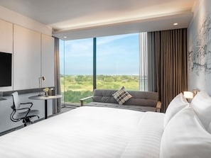 Deluxe Room, 1 King Bed, Corner | Minibar, desk, laptop workspace, soundproofing