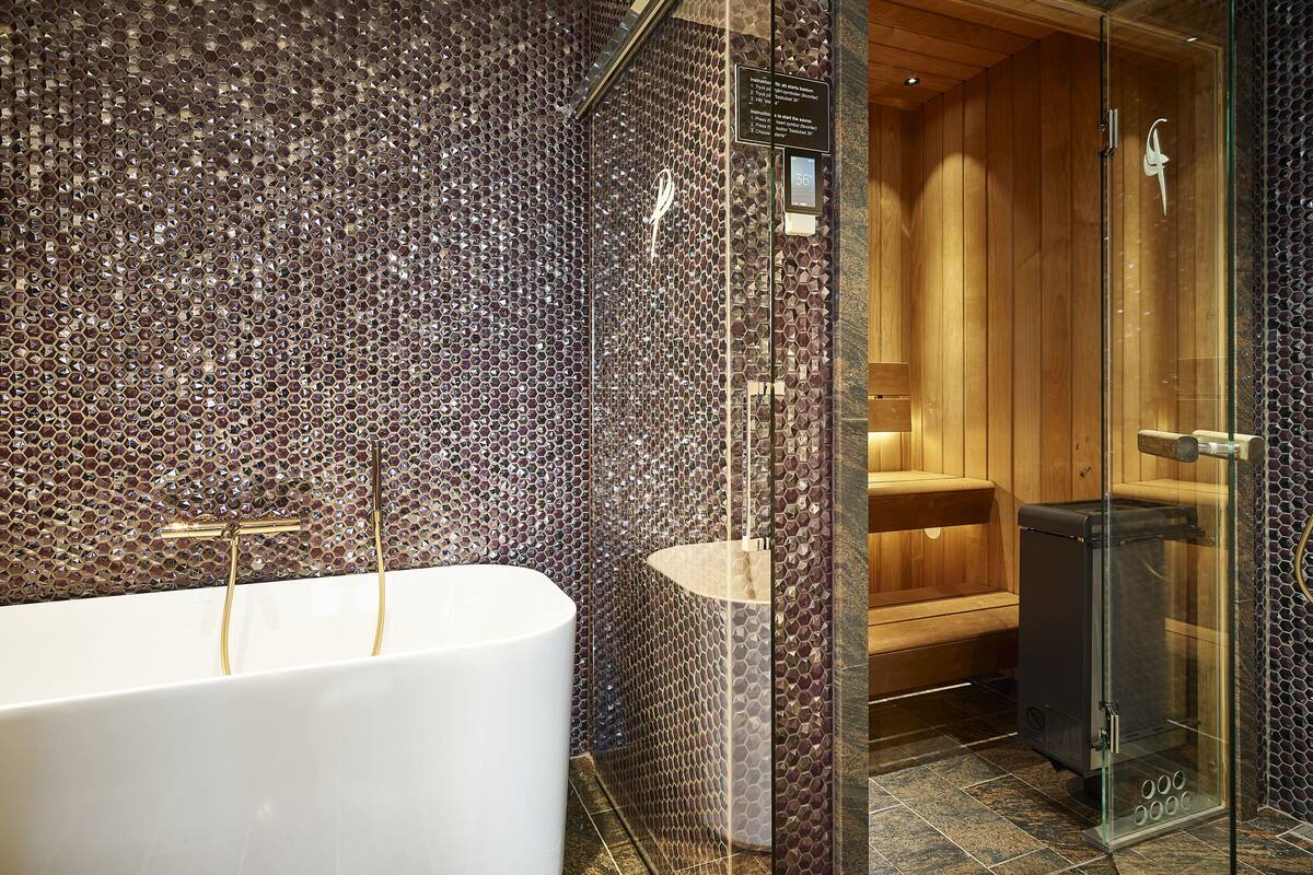 suite with private sauna | bathroom | shower, rainfall showerhead, eco-friendly toiletries, hair dryer