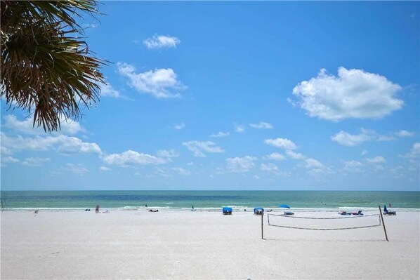On the beach, sun-loungers