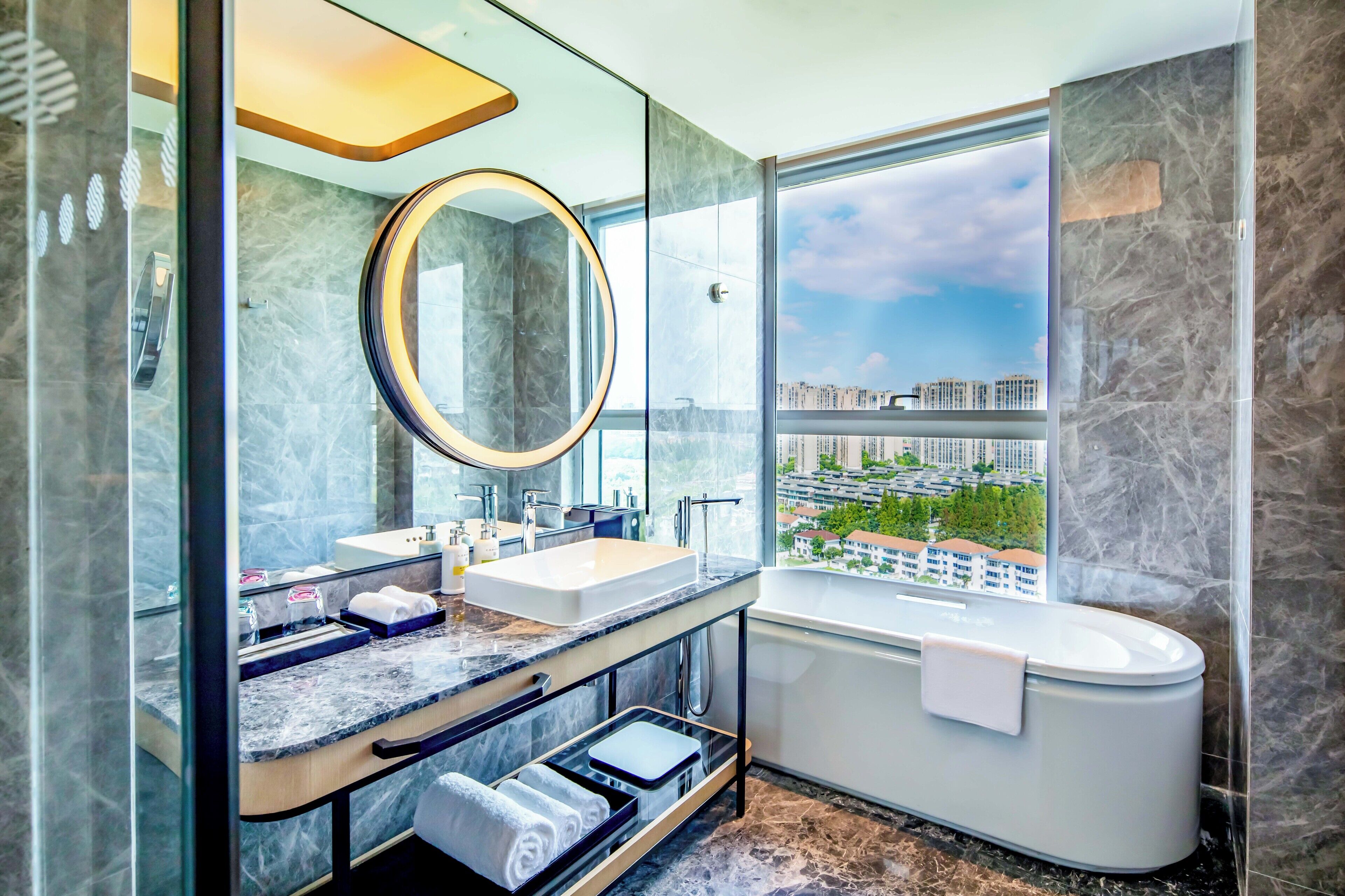 Separate bathtub and shower, rainfall showerhead, designer toiletries