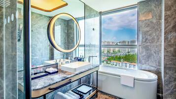 Separate bathtub and shower, rainfall showerhead, designer toiletries