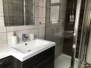 Shower, hair dryer, towels, soap
