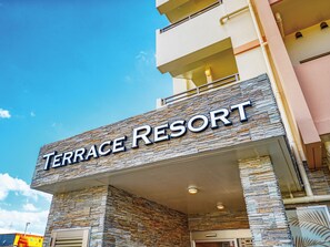 A building with a sign that reads 'Terrace Resort.' - Terrace Resort Mihama (Chatan)