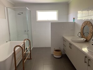 Bathtub, hair dryer, towels, soap