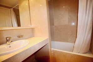 Bathtub, hair dryer, towels