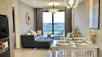 Superior Apartment | Living area | 55-inch flat-screen TV with cable channels, TV