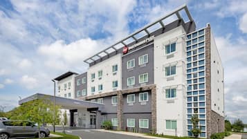 A multi-story hotel with a modern design, featuring a prominent 'BW' logo on the facade.