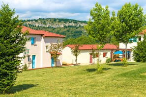 Surrounded by lush green lawns and mature trees, this serene residential area offers a tranquil setting.
