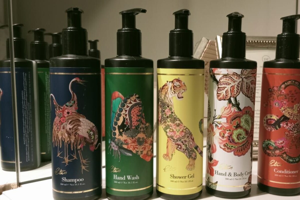 A row of personal care products on a shelf.