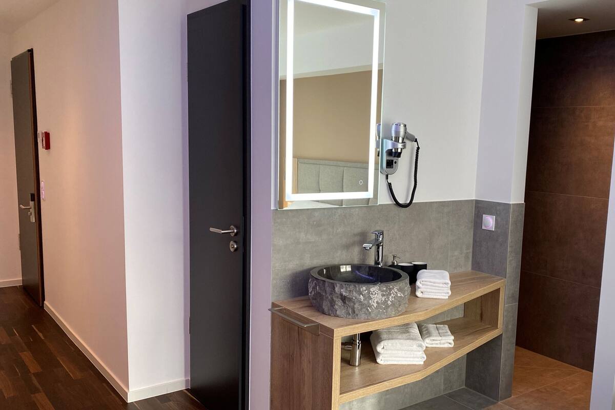 comfort double room | bathroom | shower, rainfall showerhead, hair dryer, towels