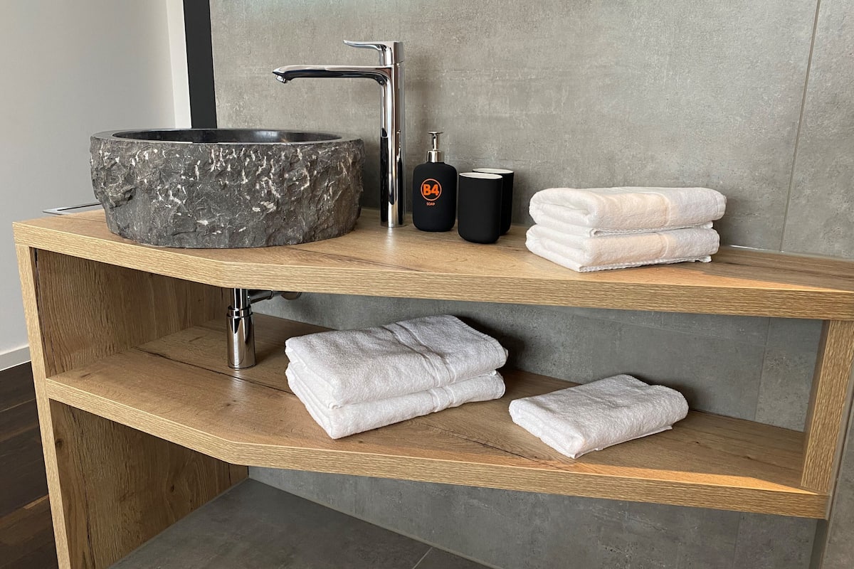 shower, rainfall showerhead, hair dryer, towels