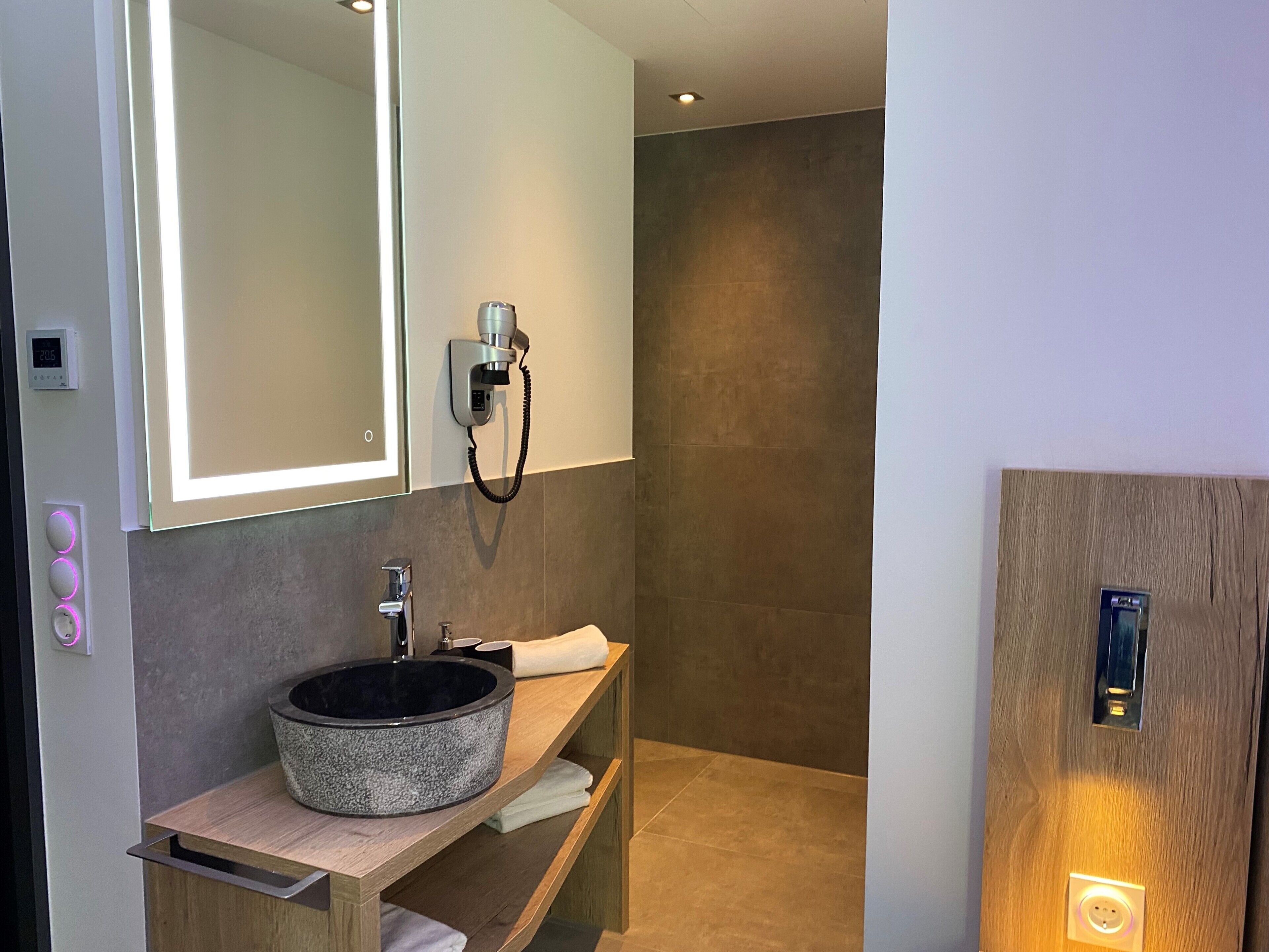 comfort single room | bathroom | shower, rainfall showerhead, hair dryer, towels