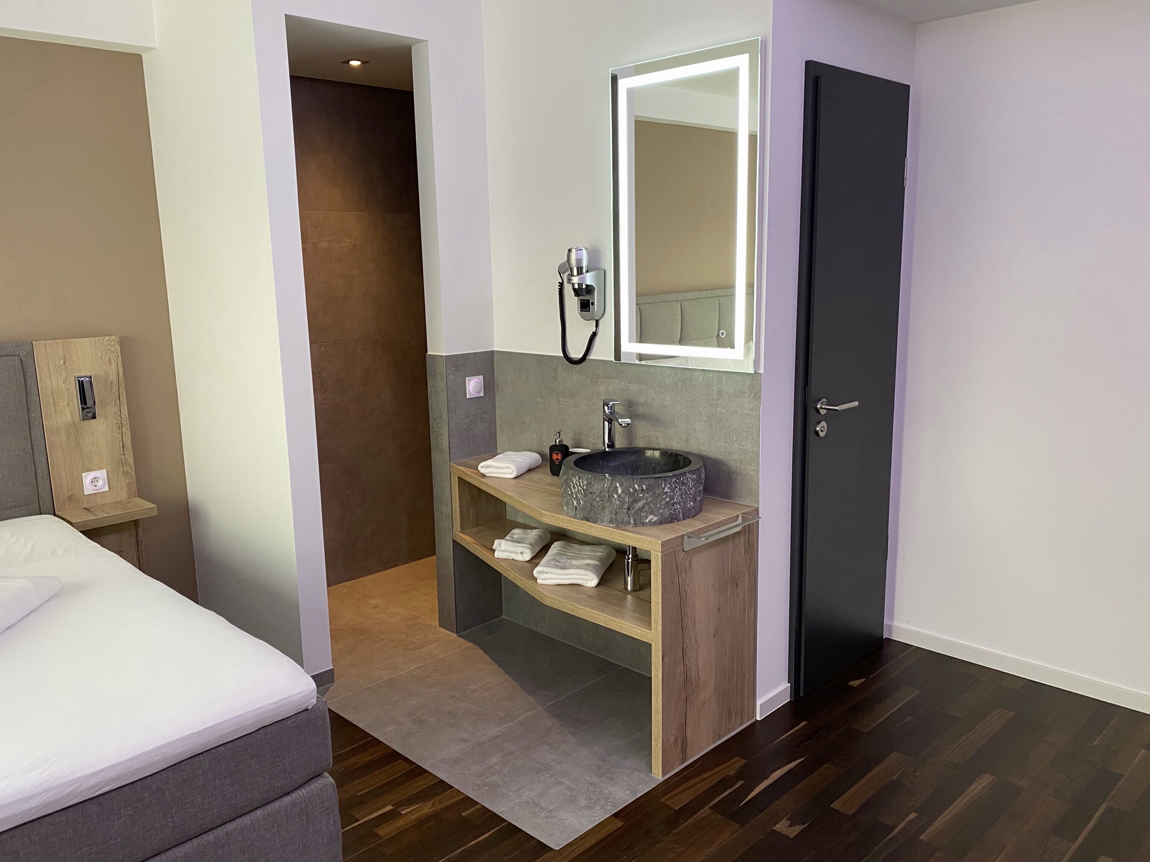 comfort single room | bathroom | shower, rainfall showerhead, hair dryer, towels