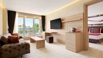 Suite, 1 King Bed, Non Smoking, Garden View | Premium bedding, minibar, in-room safe, desk