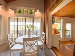 Enjoy meals in this dining area with a round table and comfortable seating for all.