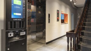 A self-service card deck with credit card and cash options, located near a reception area and a staircase. - The Shourin in Daejeon (Daejeon)