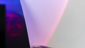 A close-up of a modern, minimalist table with a reflective surface.