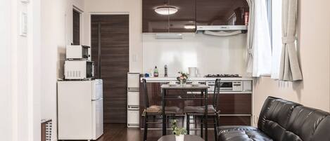 Fridge, microwave, cookware/dishes/utensils