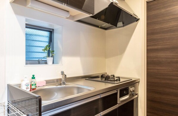 Fridge, microwave, cookware/dishes/utensils