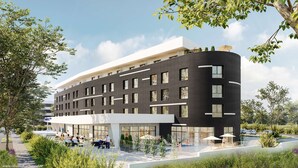 A modern hotel with a curved facade, large windows, outdoor seating, and a swimming pool. - Golden Tulip Reims (Bezannes)