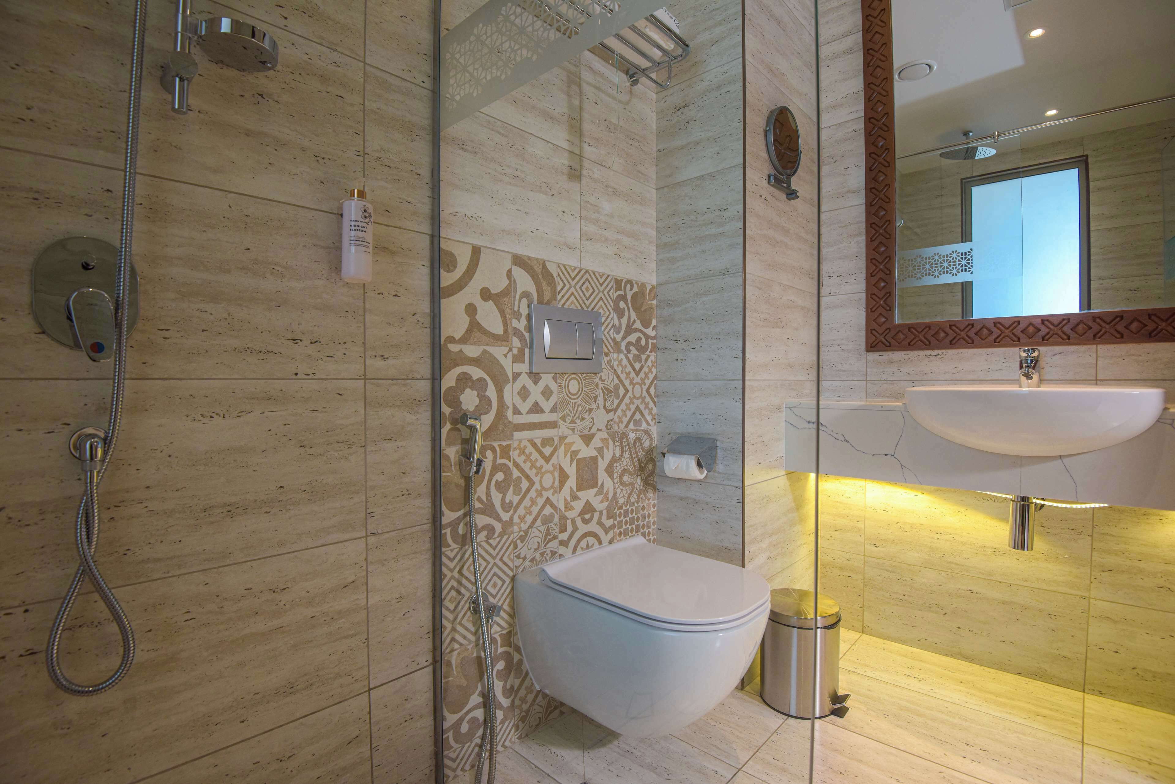 rainfall showerhead, eco-friendly toiletries, hair dryer, slippers