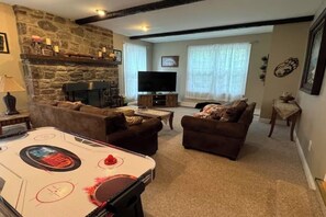 Smart TV, fireplace, foosball, books