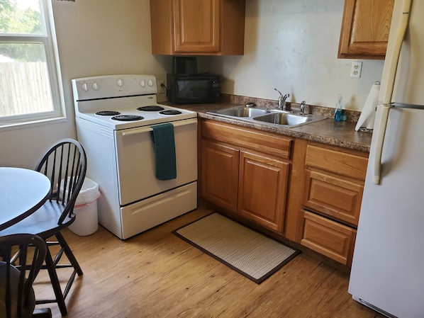 Microwave, coffee/tea maker, cookware/dishes/utensils