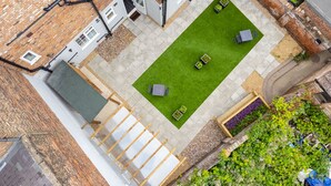 An aerial view of a courtyard with a green lawn, seating area, and a small garden. - Bricksage Rooms, King's Lynn South Gate (King's Lynn)